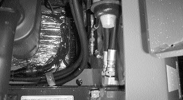 If the air flow is restricted through the cooling fins, overheating of the hydraulic system may occur. Clean any dirt buildup with compressed air. Figure 4.7E shows the radiator setup for the loader.