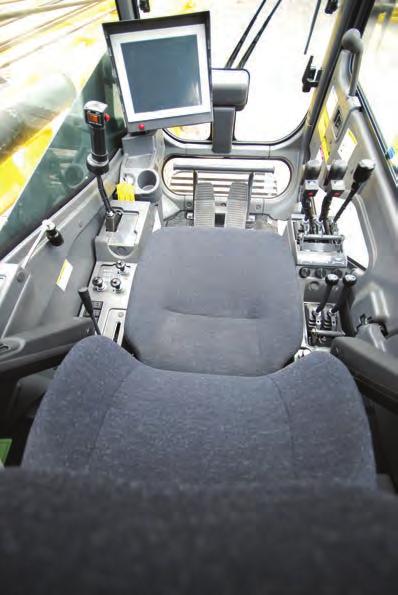 Operators cab otally enclosed from weather, this full-vision cab has safety glass all around. he adjustable, high-backed seat with armrest is capable of adjustment with or without the control console.