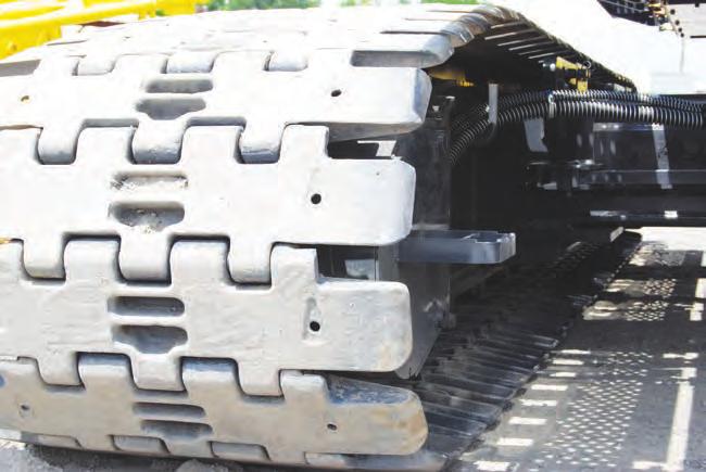 for transportation. Crawler belt tension adjusted with hydraulic jack and maintained by shims between the idler block and frame. Drums: Front drum - 614 mm P.C.D. x 617 mm Lg.