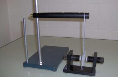 E7-02 EDDY CURRENT PENDULUM [DSC# 5K20.10] Eddy current apparatus and set of attachments Pasco magnet (as shown) Purpose: Show the damping of pendula due to eddy currents.