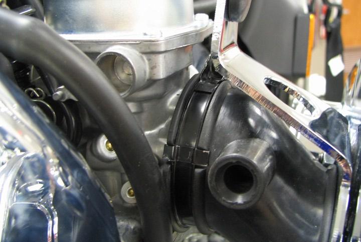Install the idle adjustment knob into the bracket. See PIC.11 for proper assembly sequence. PIC.10 STEP 23 Verify the manifold aligns with the carburetor and is not twisted; rotate the manifold for proper fit, if necessary.