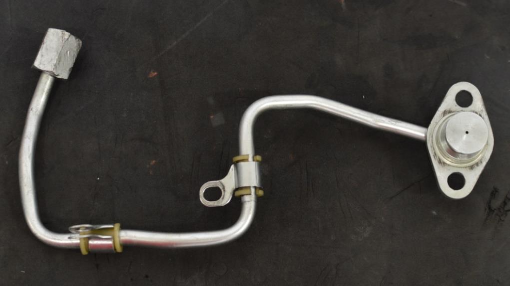 Only one OE isolator and bracket is used on the CorkSport Fuel Line a)