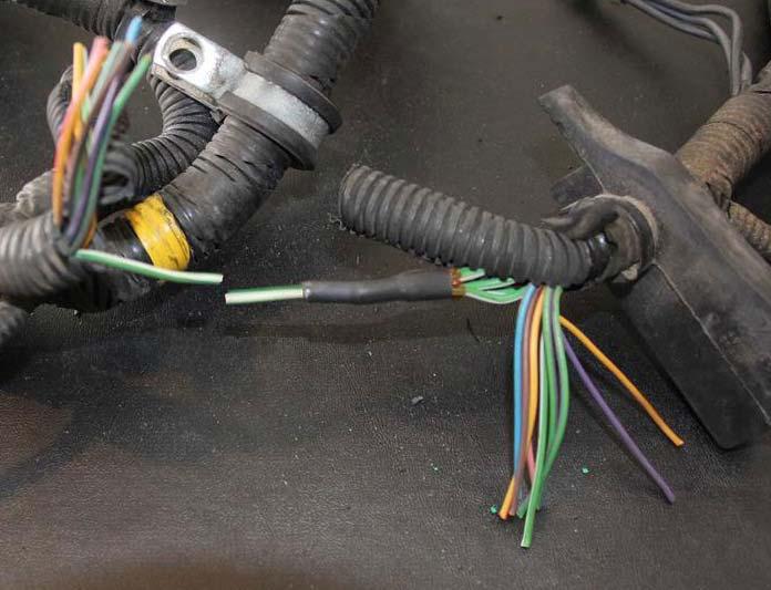 Your cut should be on the ONE wire before the 5 wire splice. Do not cut the FIVE wire bundle. The other cuts for all the other single wires can be in the same general area as your first cut.
