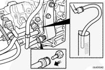 Install a quick-disconnect block-off fitting, Part Number 4918464, into the fuel drain line removed from the fuel rail pressure relief valve.