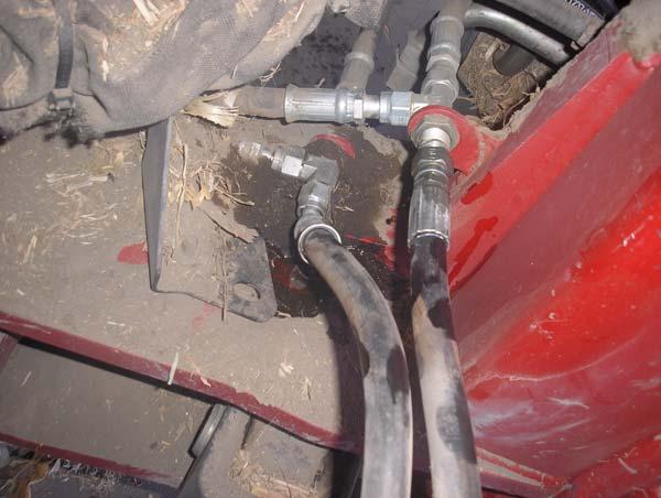 Hydraulic Hose Connection Procedures 2. Identify the two Steering hoses coming from the front of the vehicle and connecting to the two tee adapters that branch off to the two steering cylinders.