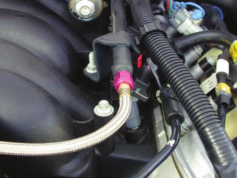 Many late model cars have several similar ports that do not contain fuel. the connector fitting. (Recommend using a proper mechanics shop rag over the fitting to avoid excess fuel spillage).