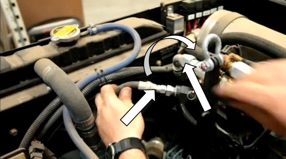 8. Reroute the hose around the opposite side (engine side) of the larger ¾ air