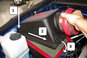 (w) Install the upper air box by lowering the hinge side into place first (Fig. 3-22).