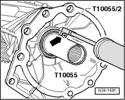 Seals, replacing Page 2 / 4 Removing - Remove transfer case 37-3, Transmission, removing and installing. - To pull out seal, install a sheet metal screw of approx. 4 mm diameter into seal - arrow -.
