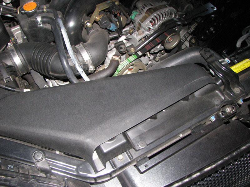 Remove the stock air filter by pulling out towards the back of the car.