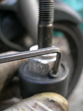 With a 3mm allen key, undo the small air bleed bolt on top of the fork stanchion and remove it.