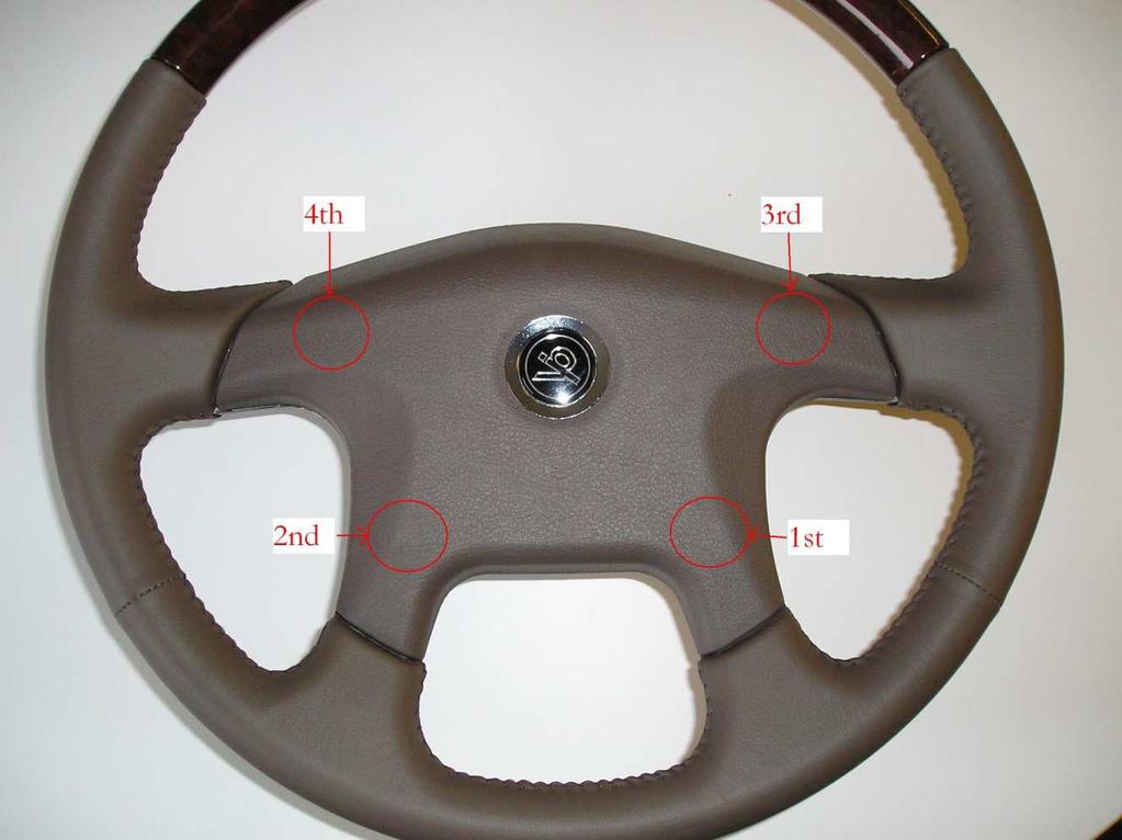 Directions for Installing Horn Pad: 1. Lay horn pad on top of steering wheel aligning the four posts of the horn pad directly on top of their respective mating holes.