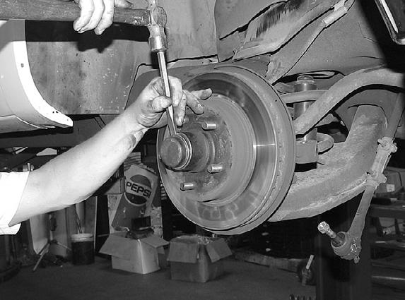 Remove the 2 bolts securing the brake caliper to the