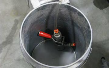 Remove the Plumbing Assembly from the Keg: unlock by pulling the Handle UP, then Twist and pull the Assembly out