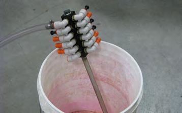 Place the Chemical Inlet Assembly (connected to the Treatment Line) in a 5 gallon pail, as shown.