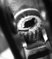 gear retaining clip with a small flathead screwdriver or sharp pick until the end of the clip protrudes past