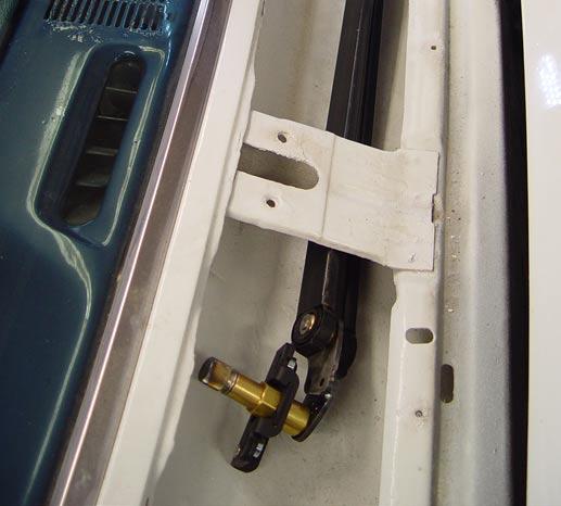 You can access the bolt head with a 7/16ths socket and extension via the vacant wiper motor hole on the firewall, assuming that you don t have a smooth firewall. 9.