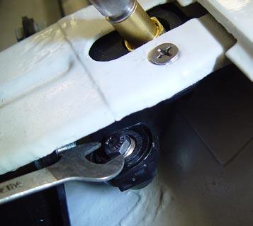 To insert the passenger side Pivot Shaft and Links Assembly (E, F, H ) into the air box, orient the knurled head at the tip of the brass pivot shaft aft (aft: towards the back of the car) See photo
