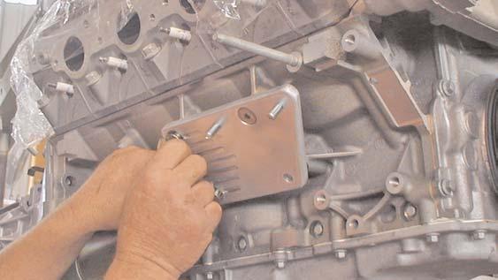 S&P makes an aluminum mounting plate to adapt to the early Chevy style rubber engine mount.