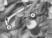 Unclip the valve from its location, then disconnect its vacuum hoses and withdraw it. 9 is the reverse of the removal procedure.