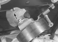 The tool should slip snugly into both slots while resting on the cylinder head mating surface; if one camshaft is only slightly out of alignment, it is permissible to use an open-ended spanner to
