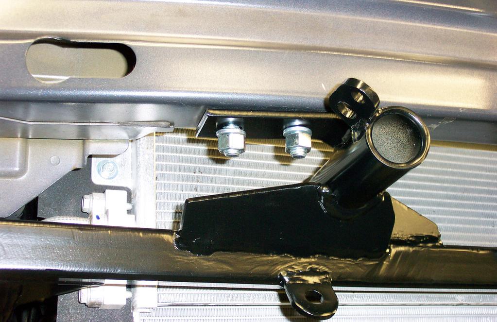 q ing plate and place it through the back of the bumper core, through the first hole you drilled, and through the upper mounting point.