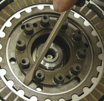 Using a pair of mechanics gloves (the edges of the ring can be sharp and may cut you), install the retaining ring into the Rekluse Center Clutch ring groove.