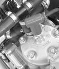Install the cylinder head (5) and tighten the five cylinder head nuts (6) to the specified torque in a crisscross pattern in 2 or 3 steps: 20 lbf ft