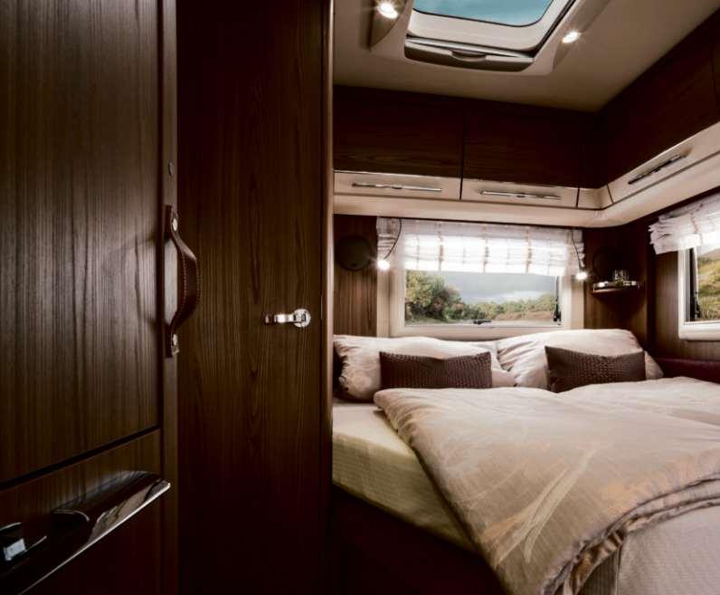 The large fixed bed in the rear of the HYMER Nova S 545 provides comfortable