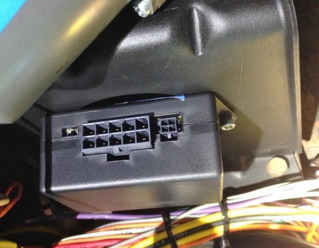 19. Install the 10-pin connector of the wiring harness into the wiper control module located on the wiper mounting bracket.