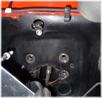 From the under the dash, place the clevis/bracket assembly through the 1 hole.