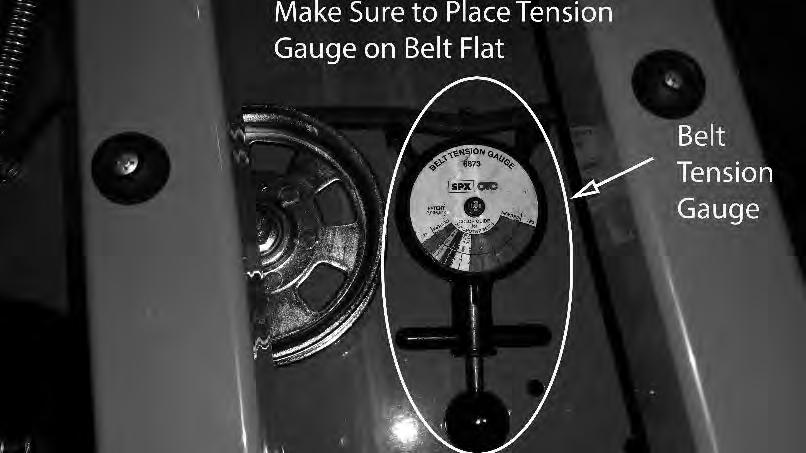 Spring tension adjustments can be made by sliding the bolt shown above forward or backward in the slot of the deck. Belt tension should be 0- lbs.