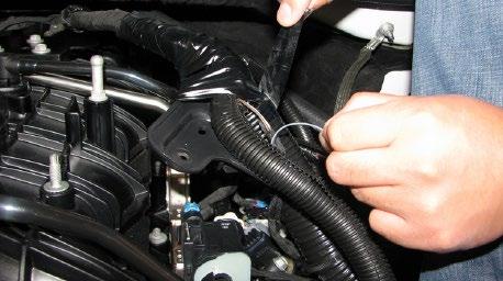 Unplug the alternator connector and remove the power cable using a 10mm socket.