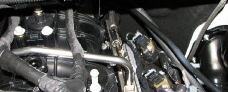 Place a towel over the schrader valve and carefully release the pressure from the fuel system using a small flat