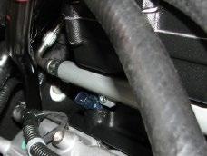 89. Lower the fuel rail assembly onto the manifold and line up the injectors with their provisions on the manifold.