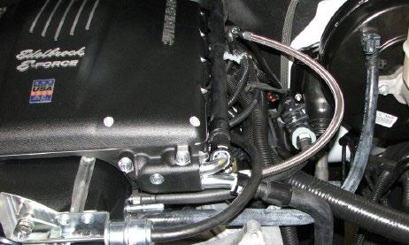 Now install the provided EVAP hose on the right rearmost barb of the manifold nose and connect it to the front barb of the solenoid.