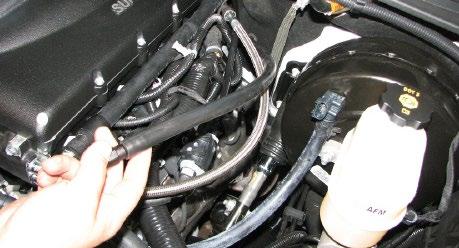 NOTE: On earlier vehicles, the rear barb on the driver side valve cover will be outfitted with a