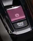 Press the parking brake switch with your foot on the brake pedal and your seat belt fastened.