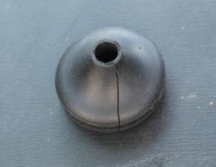 Remove rubber grommet from cardboard and cardboard cover from base to access electrical box, as shown in Figure