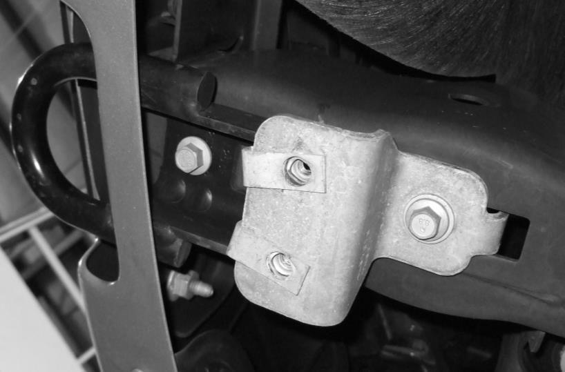 2. Remove the OEM skid plate brackets from the bottom of the frame rail by removing one (1) fastener per side with a 15mm socket Figure 2 - SKID PLATE BRACKET REMOVAL 3.