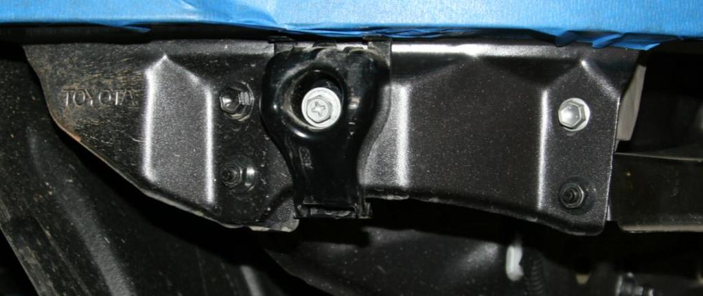 The center bracket comes out first, then the outer brackets. Figure 5 Removal of upper bumper support bracketry F.