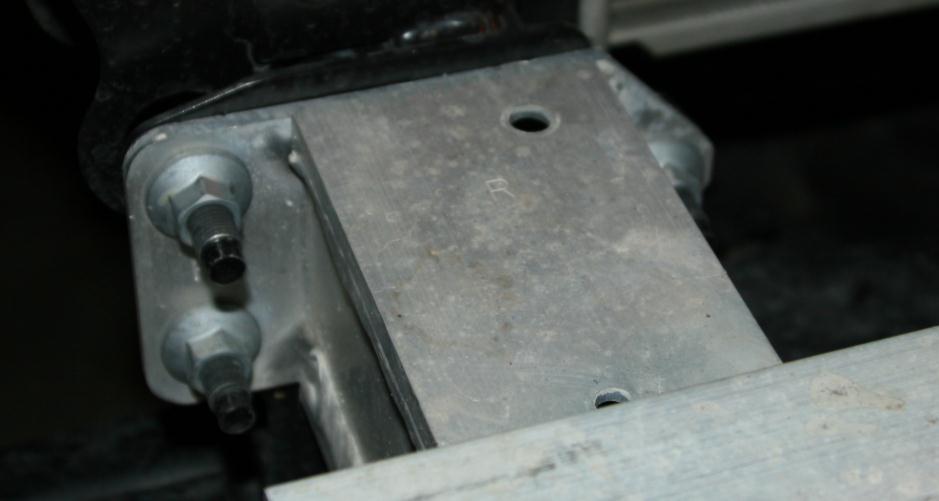 G. Remove the lower aluminum bumper structure from the vehicle by removing the six 14mm nuts.
