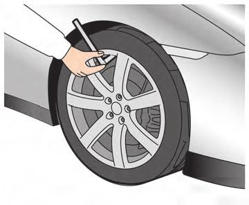 CHECKING THE TIRE PRESSURE 1. Remove the valve stem cap from the tire. 2. Press the pressure gauge squarely onto the valve stem.