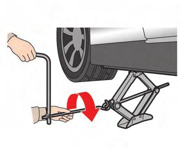 Do not remove the wheel nuts until the tire is off the ground. 4.