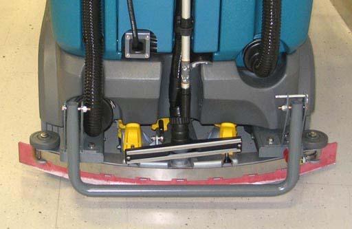 Remove the vacuum wand cap from the vacuum port and return the vacuum nozzle to the storage position and the handle to the storage