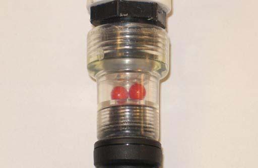MAINTENANCE 5. Turn on the water supply. The red balls inside the flow indicator will spin. The red balls stop spinning when the batteries are full. 6.