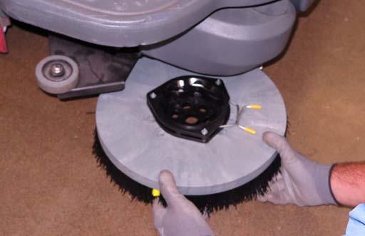 Remove any tangled string or wire from the side brush or side brush drive hub. REPLACING THE SIDE BRUSH Replace the pads when they no longer clean effectively.