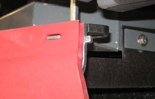 7. Hook the retaining band onto the retaining band retainer tab on the side squeegee assembly. 3.