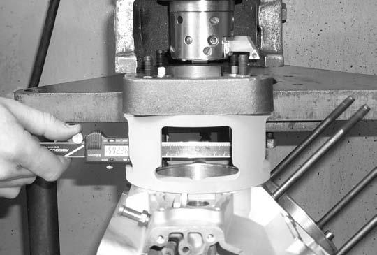 C. Center boring bar in cylinder spigot bore and set cutters to 4.075 diameter for 4 bore. For 4 1 8 bore set cutters to 4.162. D. Bore spigot hole approximately 2.