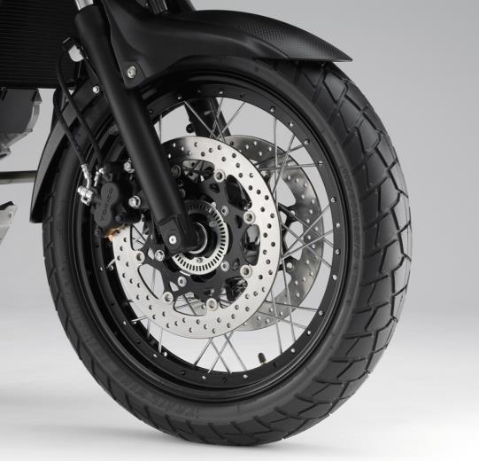 If a tubeless tire gets a small puncture, air escapes only through the hole, leading to a gentle deflation. Wheel sizes are 19-inch for front, 17-inch for rear, same as current model.
